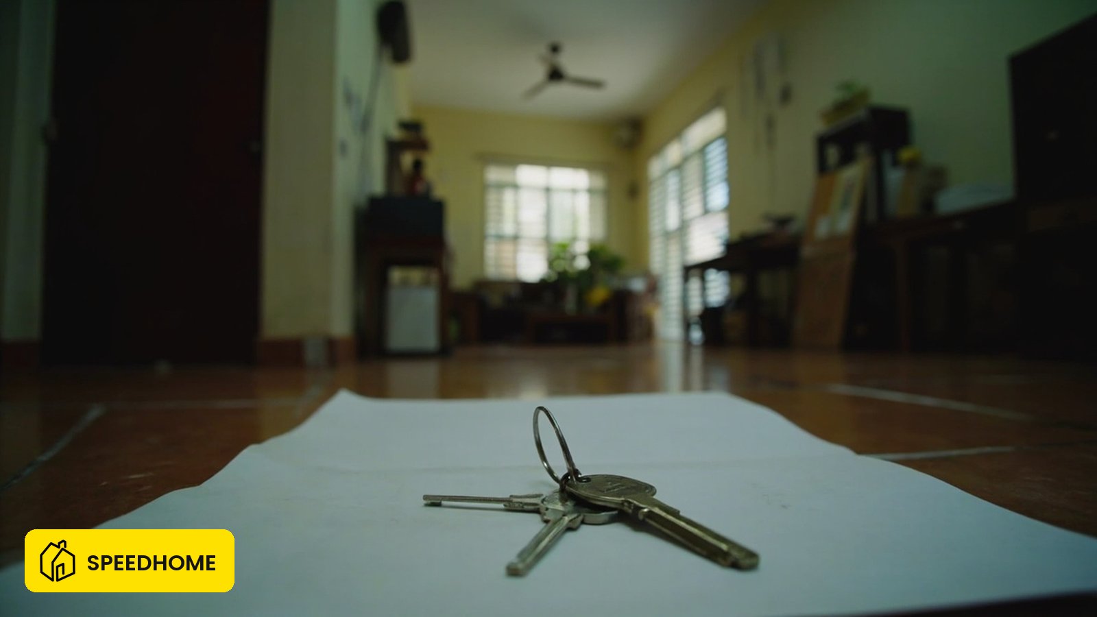 Malaysian home interior showing key and documents representing home insurance cover