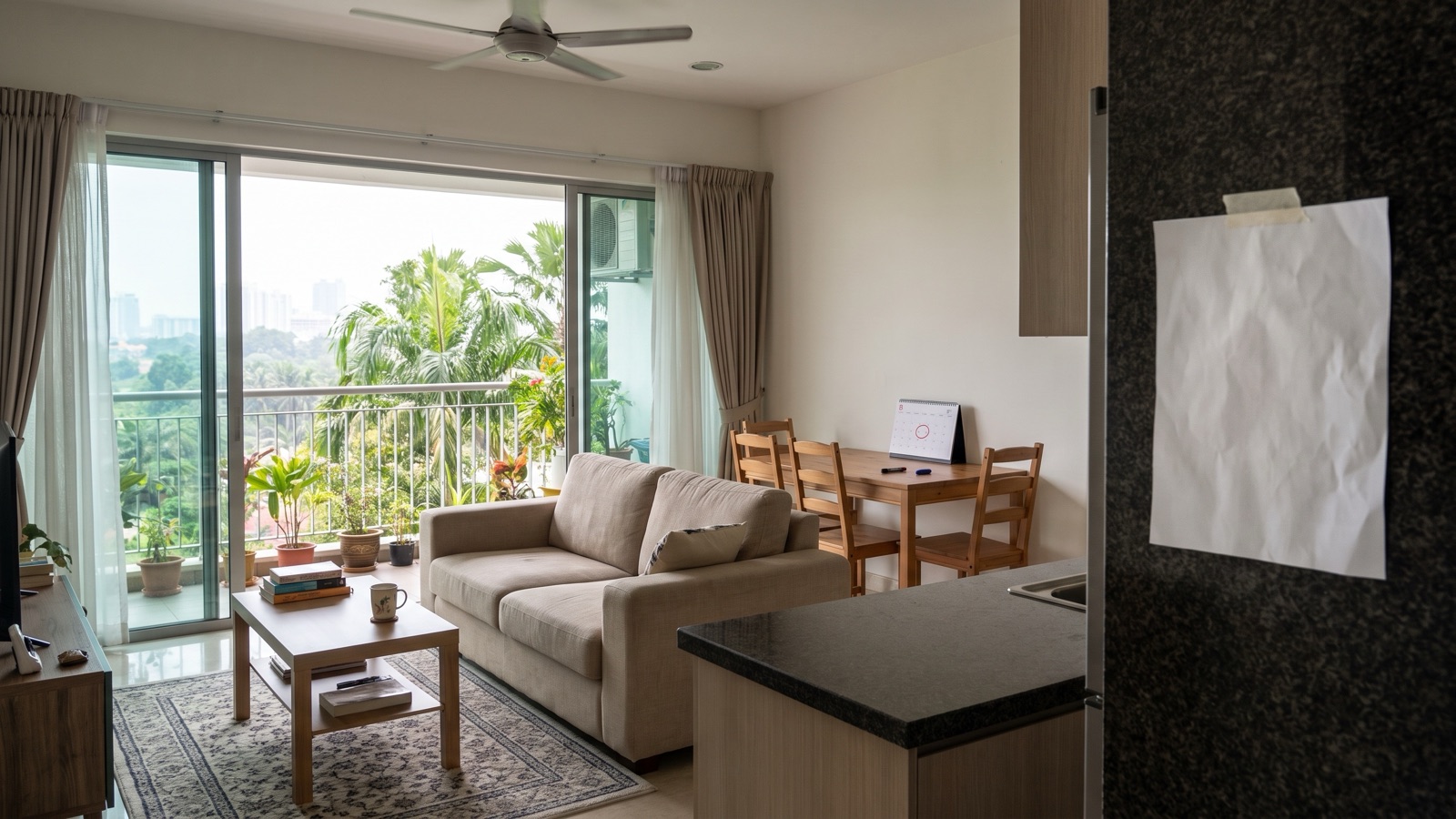 A landlord and tenant in a Malaysian apartment reviewing a renovation variation letter on a small dining table, dated photos and a key set beside them, no readable text or names, calm living-room s...