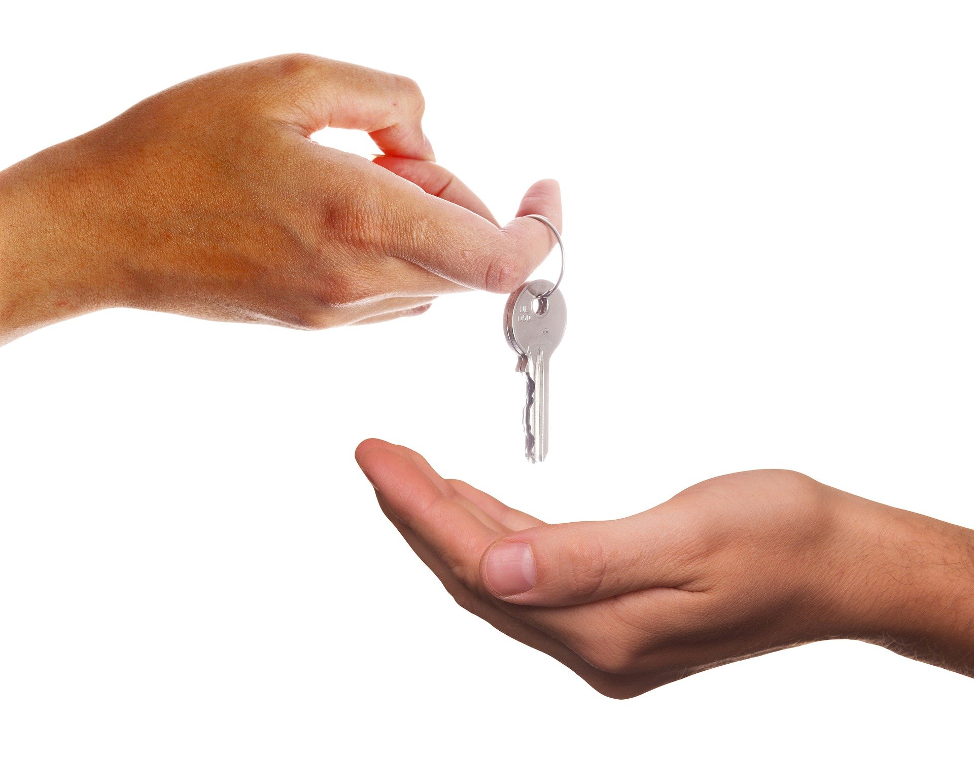 Landlord handing keys over to tenant